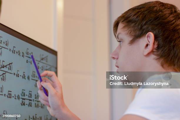 Istock Math Problems A Student Solves Math Problems On A Computer A Teenage Boy Is Studying ...