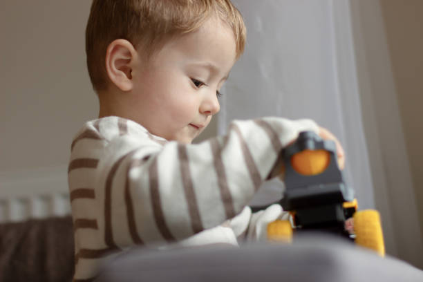 istock A child plays with a toy car. 2190860818