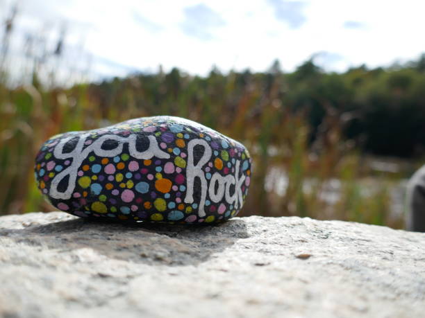 istock You rock kindness rock on rock with defocused countryside background 2190861590