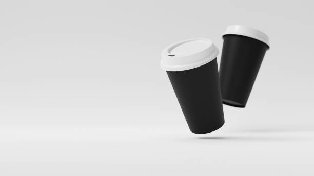 istock Two Minimalist Black Blank Paper Coffee Cup floating above white background. Takeaway paper coffee cup fly, 3d render illustration 2190861931