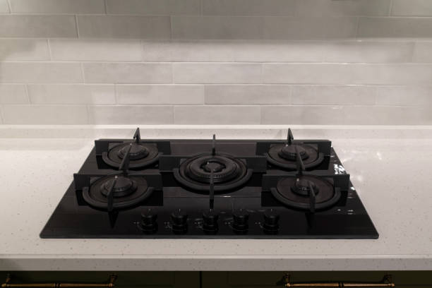 istock Black glass gas stove on stone countertop 2190863377