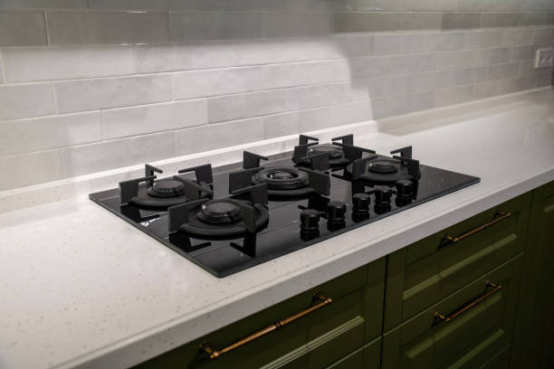 istock Modern black glass gas stove on stone countertop 2190863380