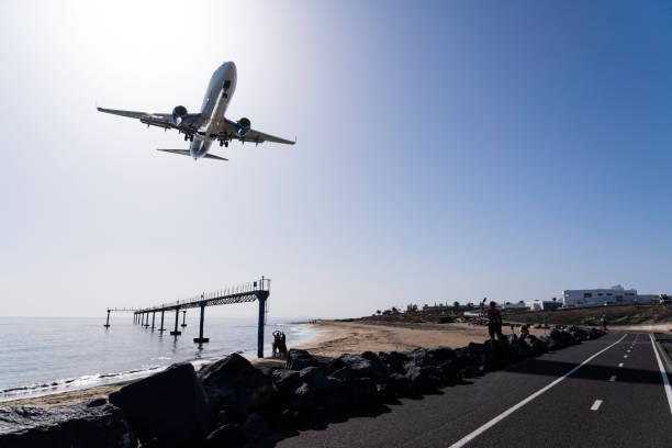 istock Airplane Approaching Lanzarote Over Beach and Runway Approach Lights on the Atlantic Coast 2190865500
