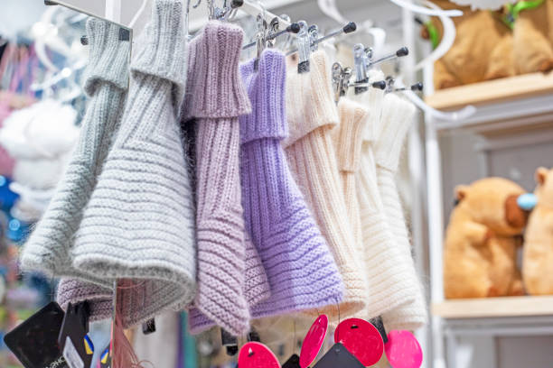 istock stylish warm knitted natural hats scarves on a hanger 2190868005