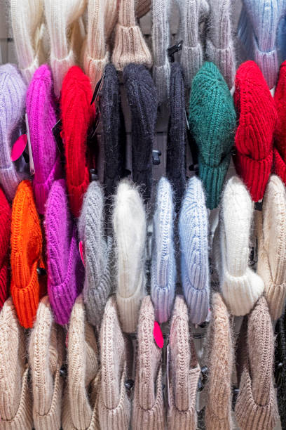 istock stylish warm knitted natural hats on a hanger 2190868133