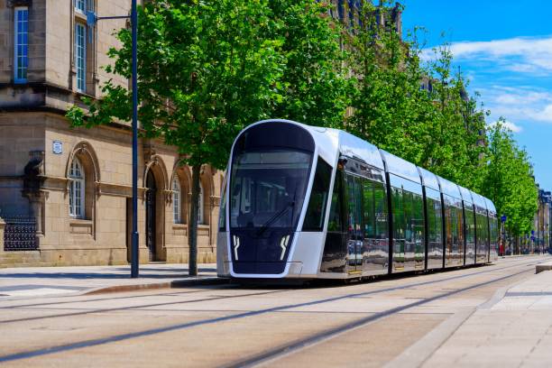istock Luxembourg, Dynamic Modern Tram Gliding Through Urban Landscape with Charming Vintage Architecture in View 2190869905