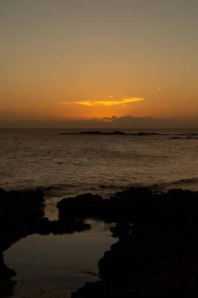 Beautiful and romantic orange sunset over the sea. Preserved environment. Brazil