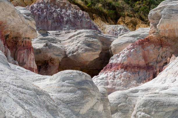 istock Unique rock formations and colorful geological patterns in a remote area showcasing the beauty of nature's sculpting in vibrant hues during midday 2190876493