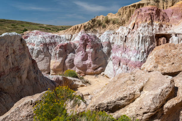 istock Colorful rock formations in a remote canyon exhibit unique geological layers under a clear blue sky during midday in a natural reserve 2190876565