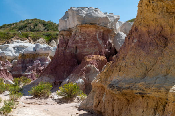 istock Colorful rock formations rise amid sparse vegetation in a scenic landscape during daylight in a natural preserve 2190876673