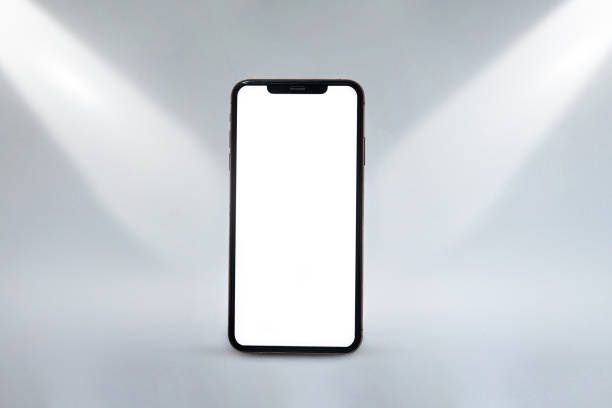 istock A phone is sitting on a table with a white background 2190882129