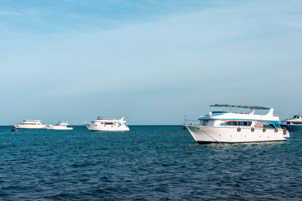 istock Tranquil yachts on serene blue sea under clear sky 2190884490