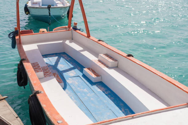 istock Tranquil coastal scene with empty boat on turquoise waters for nautical decor 2190885072