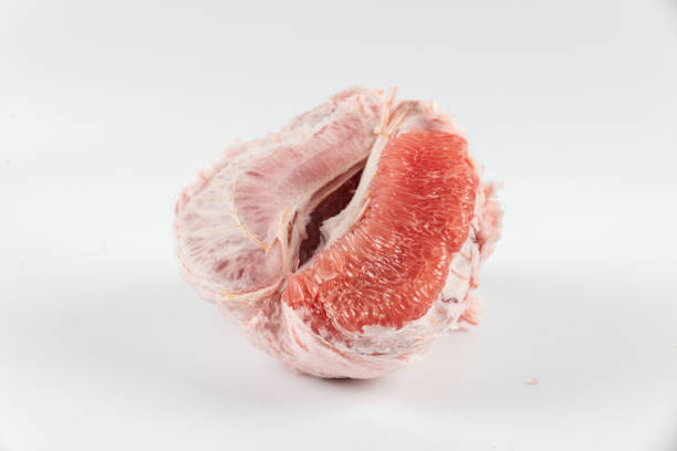 Red flesh of grapefruit on white background