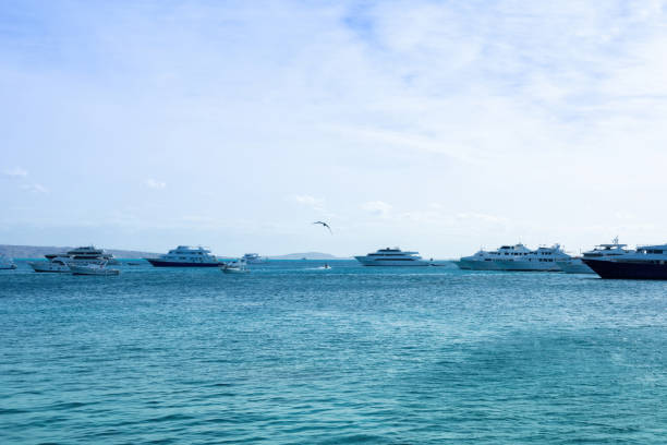 istock Serene seascape with boats on clear blue water under bright sky 2190885842