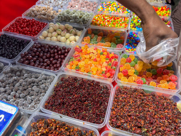 istock A person is reaching into a pile of candy 2190891394