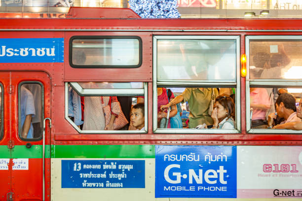 Bangkok, Thailand - December 22, 2009: people travelling in a bus in downtown Bangkok.