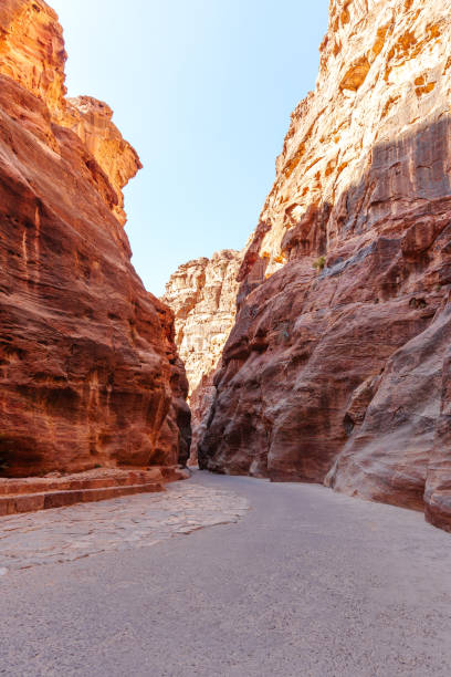istock A scenic desert passage featuring towering rock formations with vibrant natural hues and textures. 2190899457