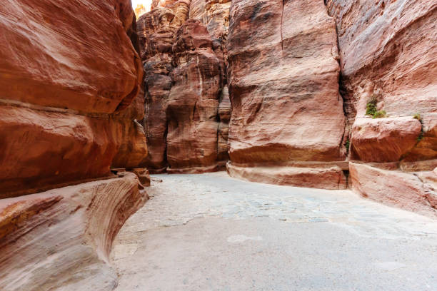 istock A scenic desert passage featuring towering rock formations with vibrant natural hues and textures. 2190899778