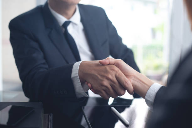 istock Businessmen making handshake with partner at office, greeting, dealing, merger and acquisition, successful deal concept, for business, finance and investment background, teamwork, partnership, hand shaking 2190900560