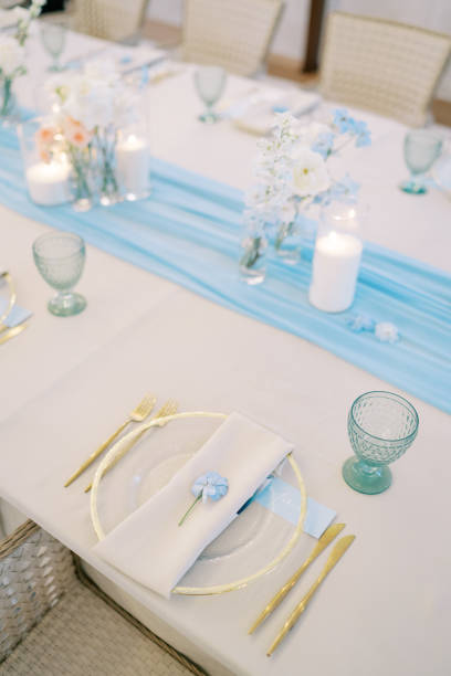 istock Blue flower lies on a napkin on a plate on a festive table 2190901164