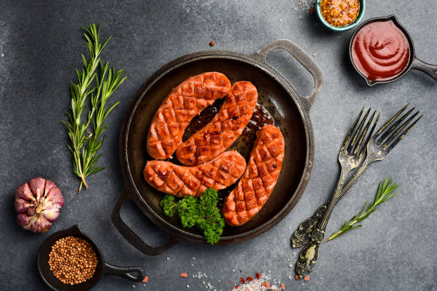 istock Fried chicken sausages. On a gray stone background. Top view. 2190901511