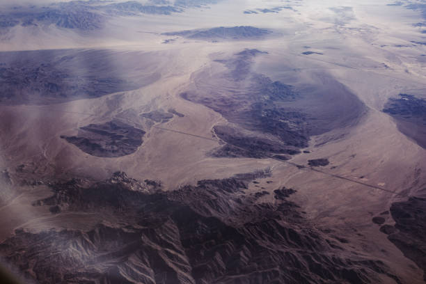 istock Airplane view over desert and mountains 2190902974