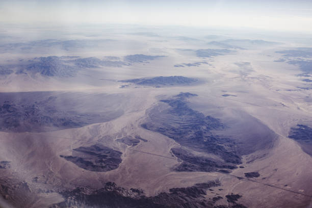 istock Airplane view over desert and mountains 2190902978