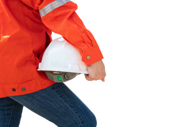istock A construction worker holding a white safety helmet. Clipping path on white background. 2190905536