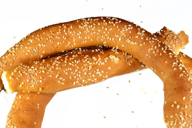 Single soft pretzel isolated on a white background. Minimal food photography ideal for packaging, branding, and bakery menu design.