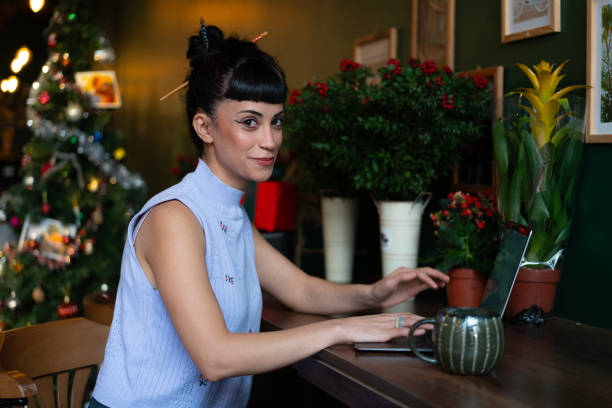 istock Young florist working on laptop during christmas season 2190906388