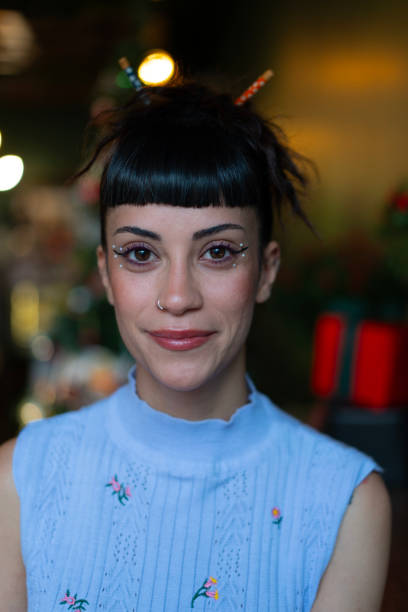 istock Young woman smiling at christmas time 2190906597
