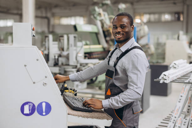 istock Factory worker operating industrial machinery for pvc windows and doors production 2190911151