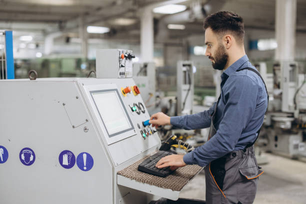istock Factory worker operating industrial machinery producing PVC windows and doors 2190911156