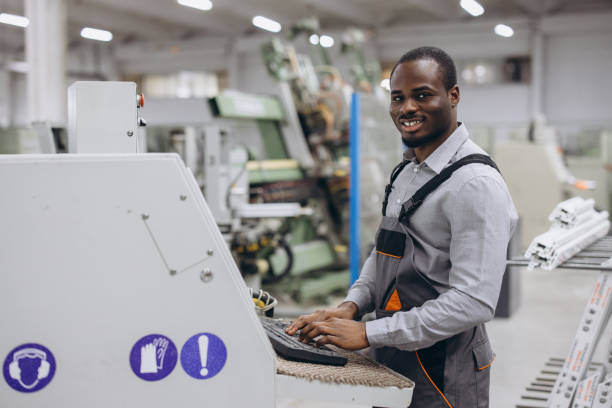 istock Factory worker operating machinery for pvc windows and doors production 2190911185