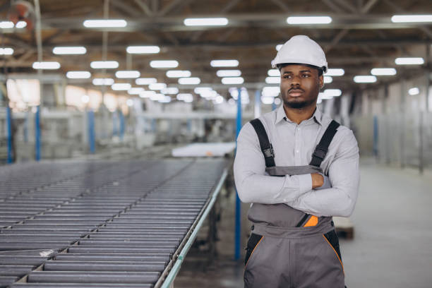 istock Supervisor posing with arms crossed in window factory 2190916740