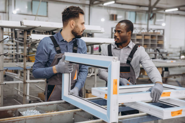 istock Factory Workers Manufacturing PVC Windows in Production Line 2190917620