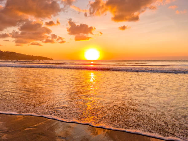 istock Sunset over the ocean in Jimbaran beach, Bali, Indonesia 2190920006