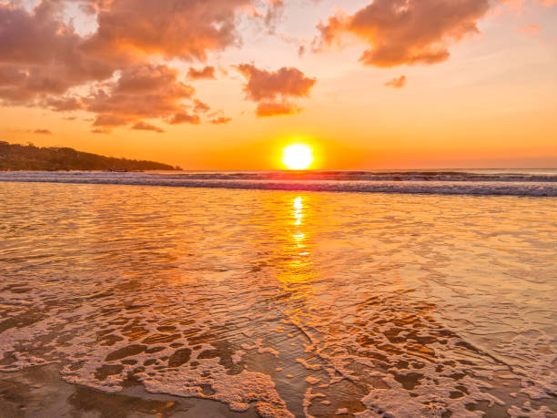 istock Sunset over the ocean in Jimbaran beach, Bali, Indonesia 2190920008