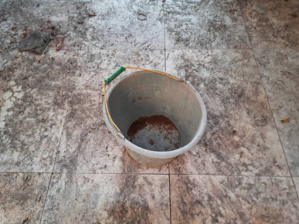 istock Used construction bucket, covered by dry cement. Bucket for mixed cement. 2190922389