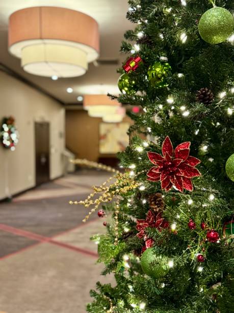istock Red and gold Christmas tree at office holiday party 2190922771