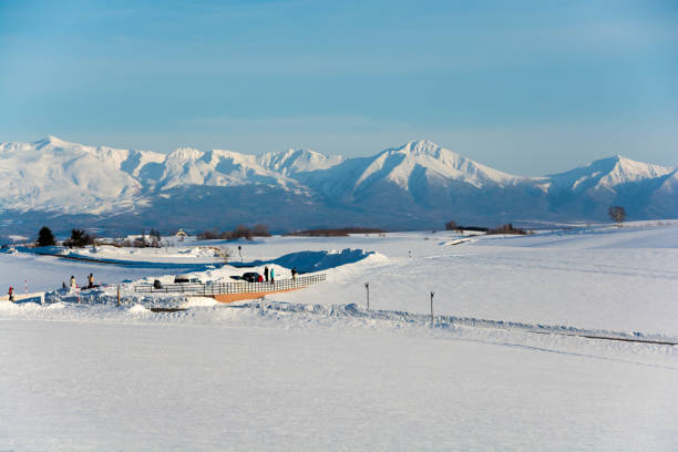 Snowy hills and snowy mountains with blue sky