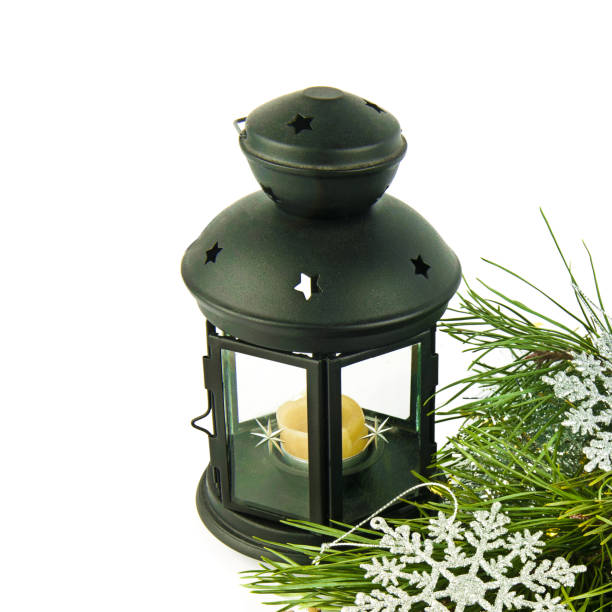 Decorative Christmas lantern with candle isolated on white. Free space for text.