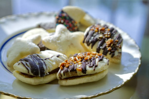 Assorted Vanilla Cookies Decorated with Chocolate and Sprinkles on a Plate