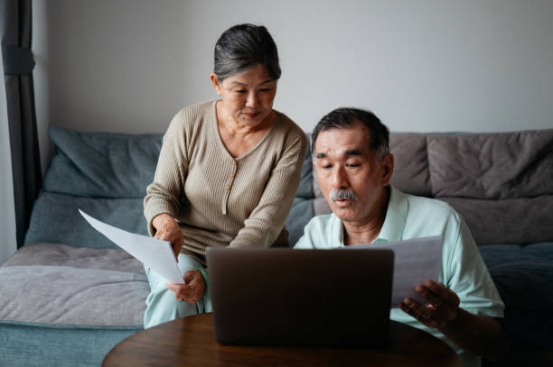 istock Senior couple managing finances at home 2190933109