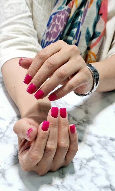 istock Image of a woman's manicured nails with pink polish 2190935729
