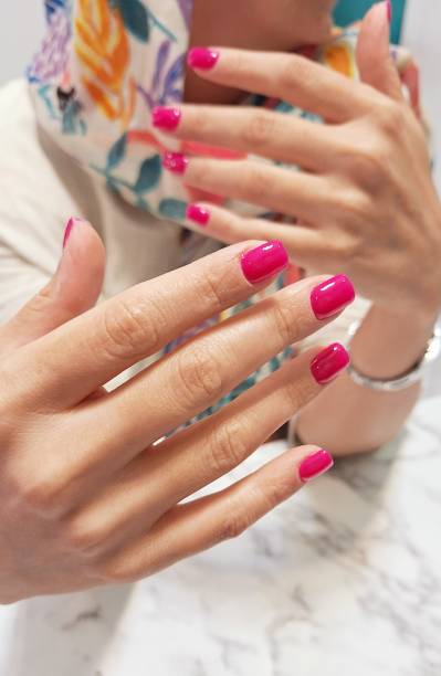 istock Close-up of a woman's hands with a pink manicure 2190935731
