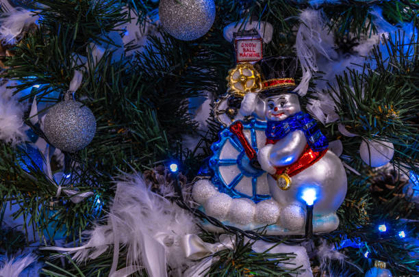 Decorating an artificial Christmas tree, hand-made Christmas tree decorations, blowing and painting Christmas baubles