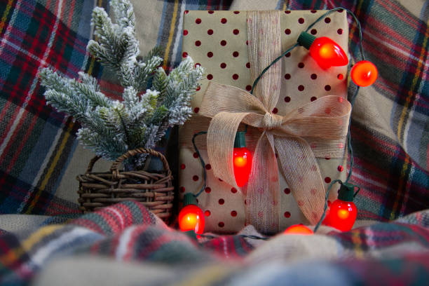 Gifts wrapped in red polka dots and lights