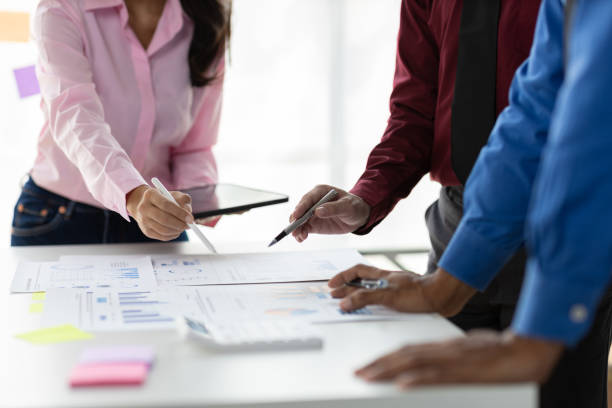 istock Data analysis, marketing strategy or statistics by business development leaders planning company growth. Hands of finance managers in a meeting discussing about financial performance in office. 2190942800